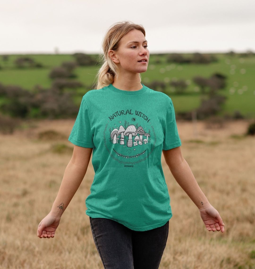 model wearing a sea green turquoise natural witch and mushrooms t-shirt, designed by MooksGoo