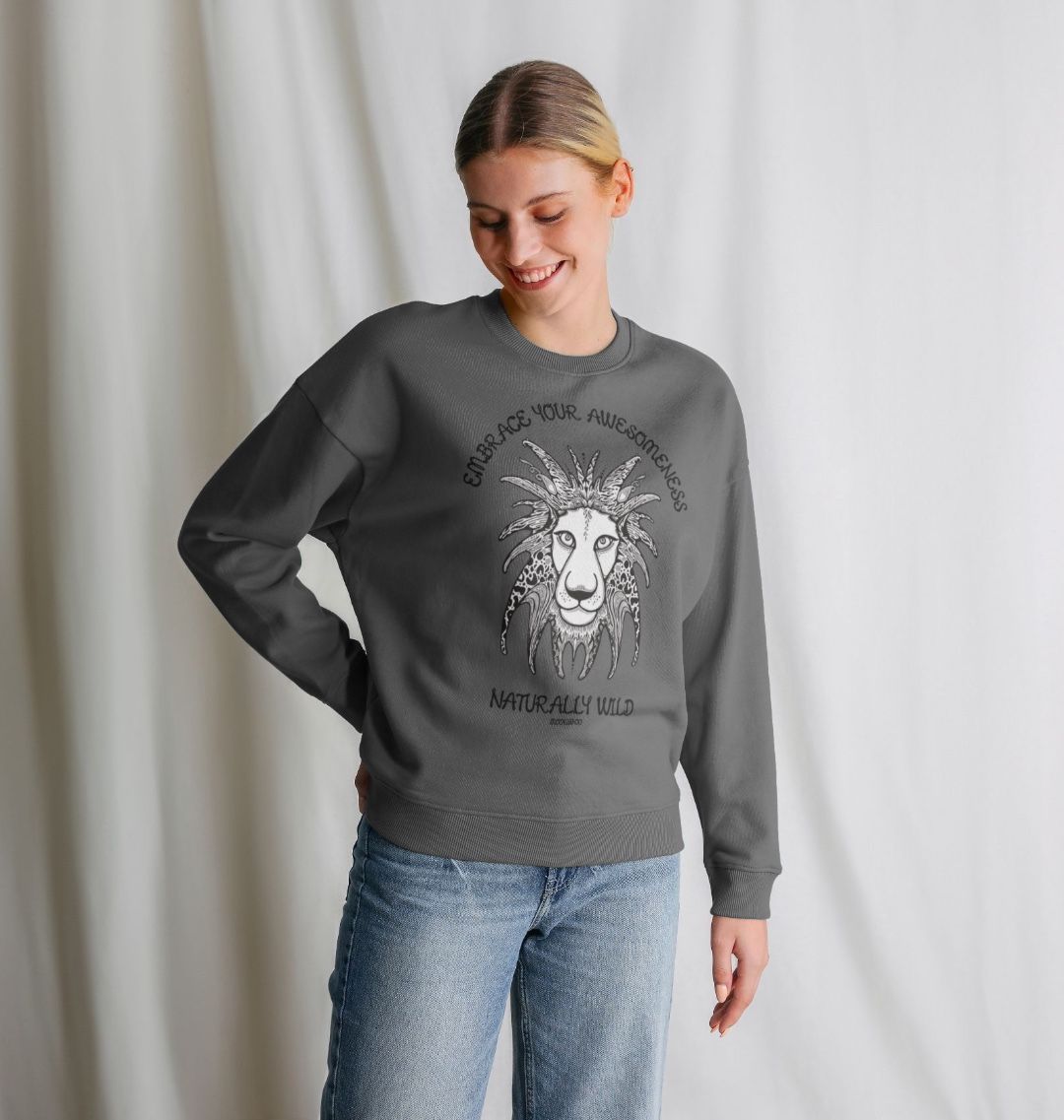 Model with blonde hair wearing an Slate grey organic cotton oversized sweatshirt with embrace your awesomeness naturally wild fun typography, and an illustrated wild lion, designed by MooksGoo