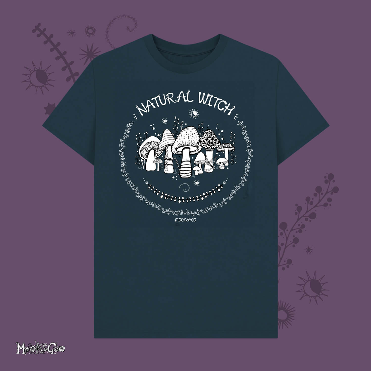 denim blue unisex t-shirt with white illustrations of mushrooms, toadstools, moons, stars, leaves and vines, with the words Natural Witch in funky typography, halloween spooky design by MooksGoo