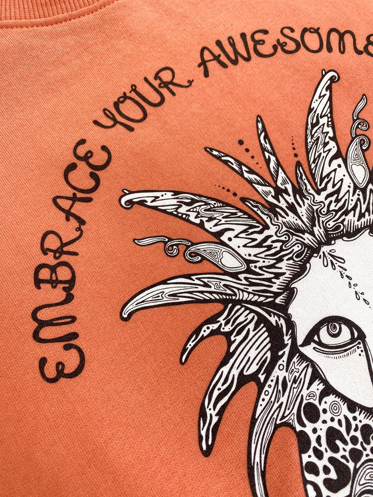 close up of the texture and quality of the oversized women's embrace your awesomeness wild lion jumper, designed by MooksGoo