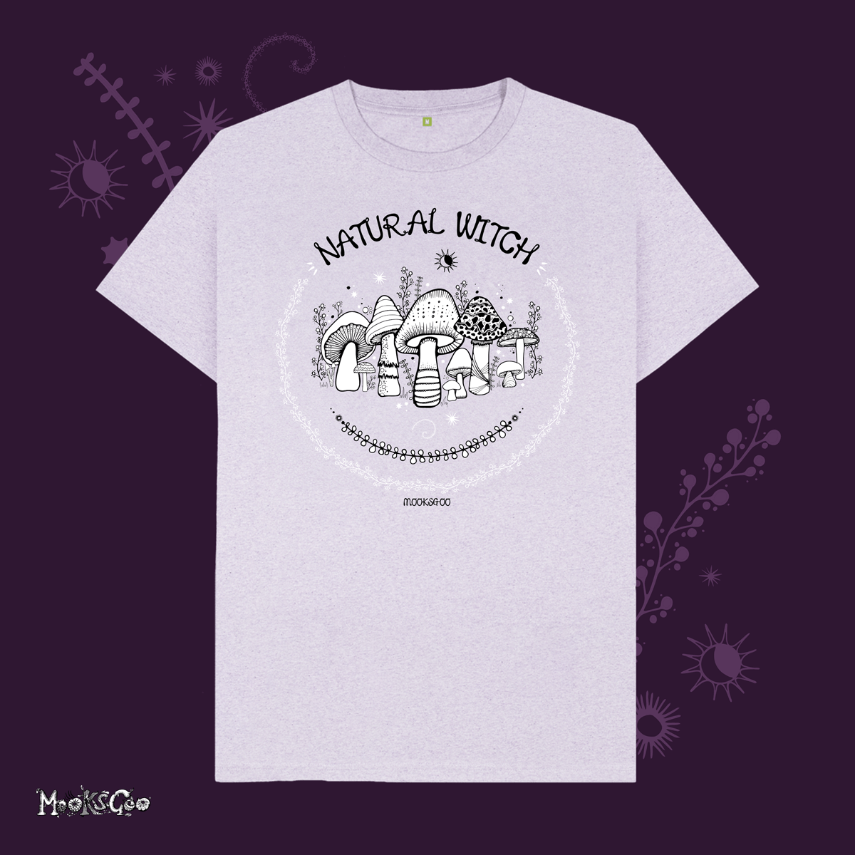 light purple organic cotton recycled t-shirt with script typography fonts that says natural witch, with black and white illustrations of mushrooms, toadstools, leaves, sun and moon and stars, designed by MooksGoo