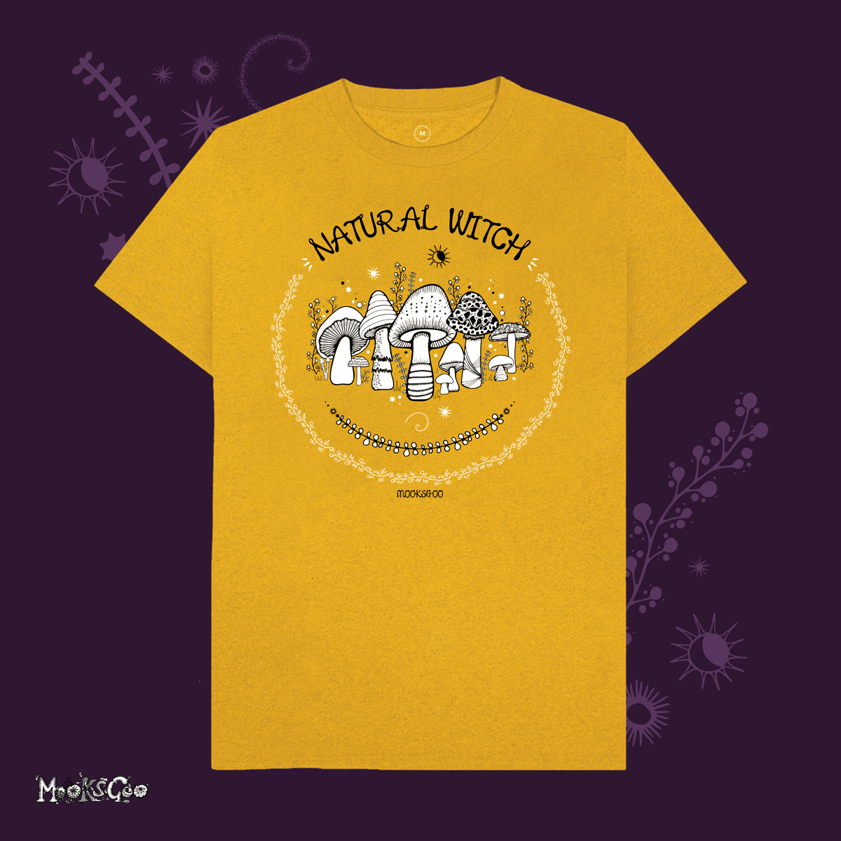 sunflower yellow organic cotton recycled t-shirt with script typography fonts that says natural witch, with black and white illustrations of mushrooms, toadstools, leaves, sun and moon and stars, designed by MooksGoo