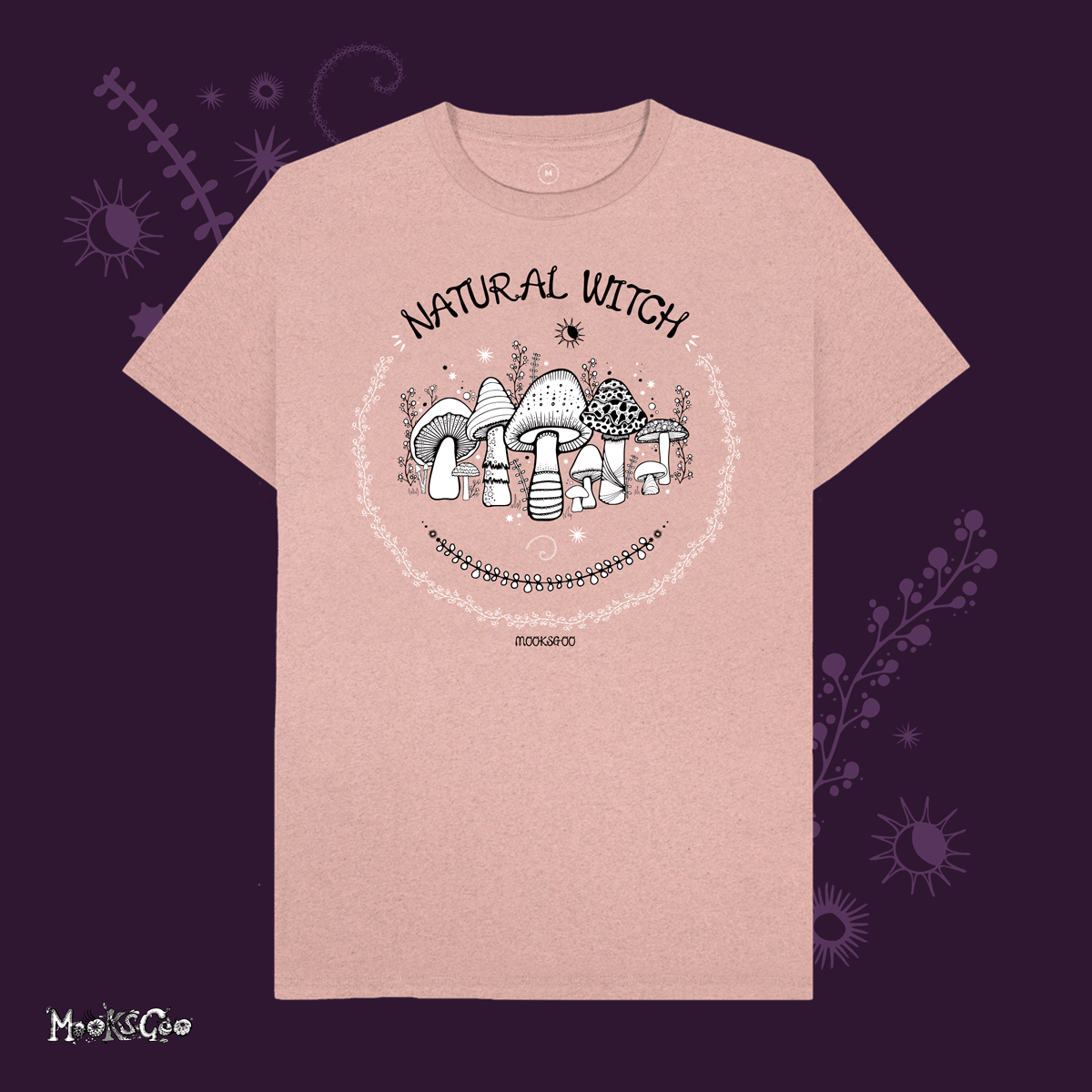 sunset pink organic cotton recycled t-shirt with script typography fonts that says natural witch, with black and white illustrations of mushrooms, toadstools, leaves, sun and moon and stars, designed by MooksGoo