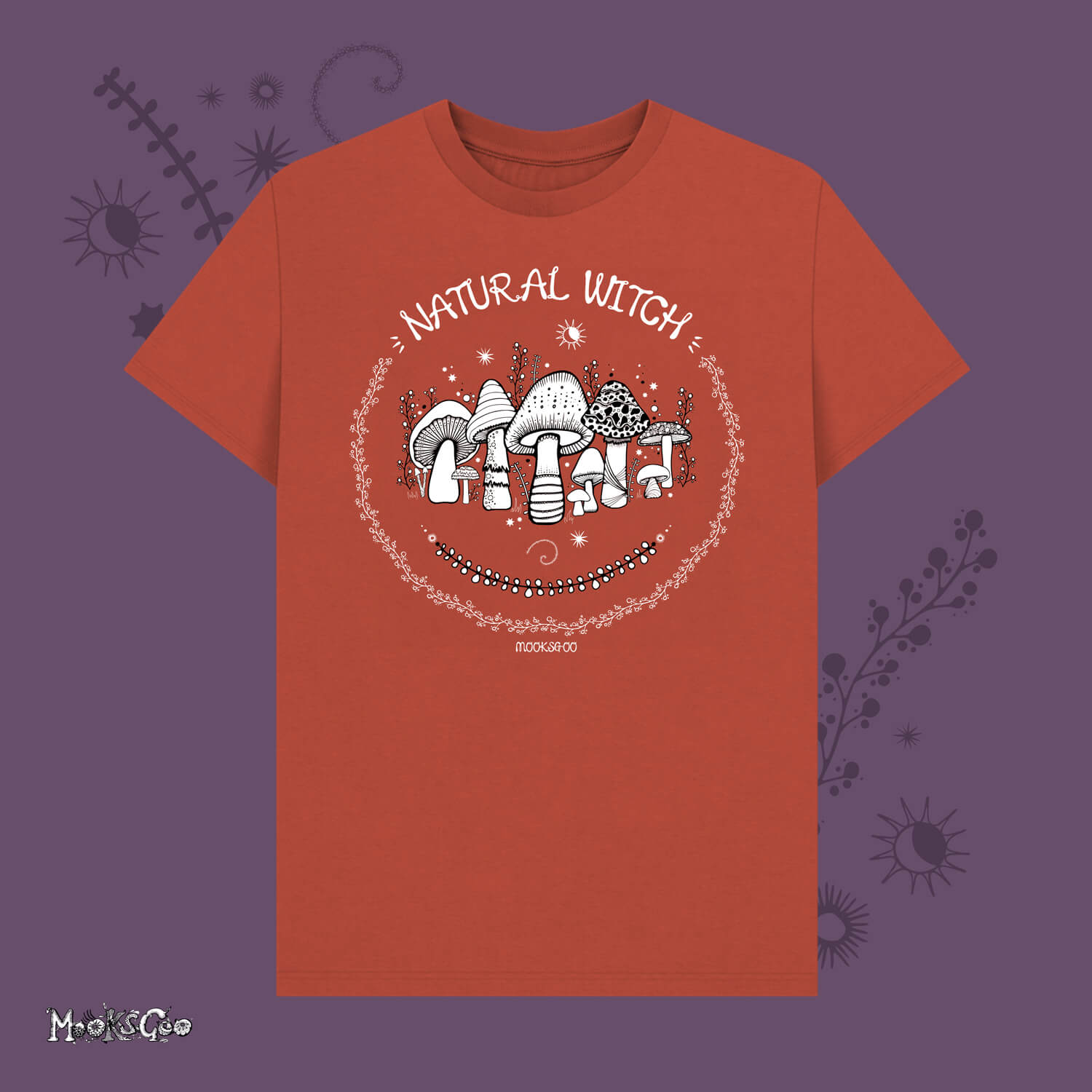 Rust unisex t-shirt with white illustrations of mushrooms, toadstools, moons, stars, leaves and vines, with the words Natural Witch in funky typography, halloween spooky design by MooksGoo