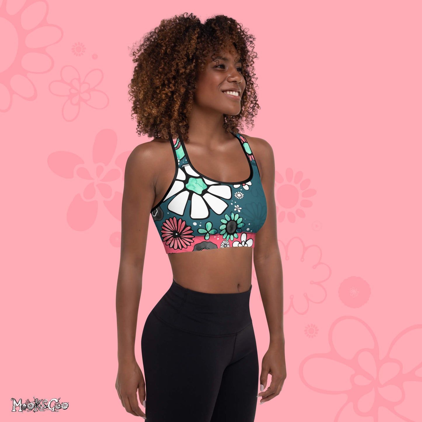 Supportive bright and funky flower power sports bra designed by MooksGoo, with turquoise and coral pink illustrated flowers - right side view.