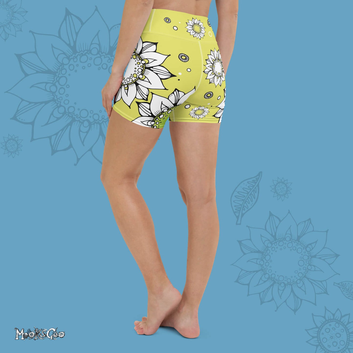Funky lime green comfortable, super buttery soft yoga, workout, or cycling shorts, with bold black and white sunflowers, designed by MooksGoo. Model showing the back of the shorts