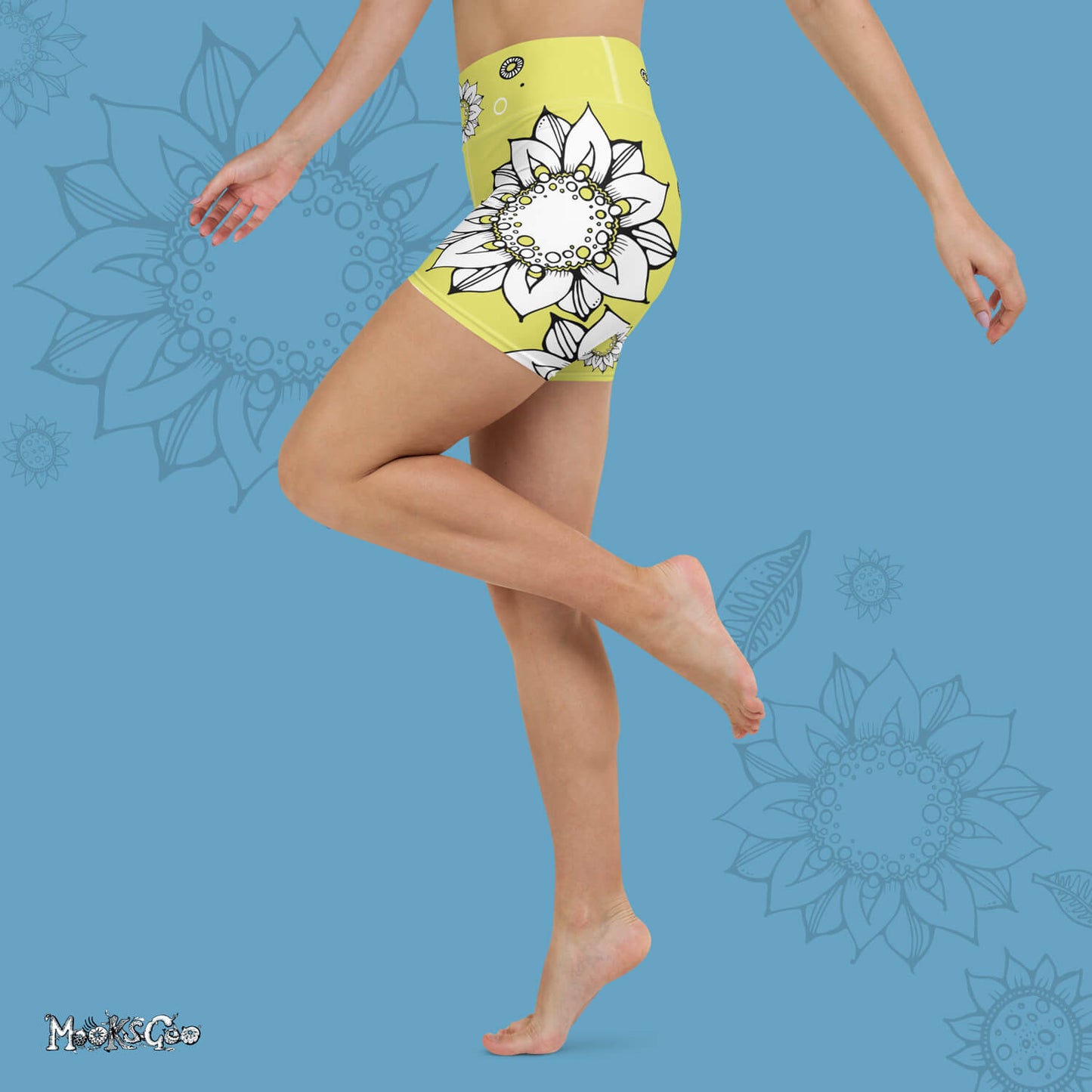 Funky lime green comfortable, super buttery soft yoga, workout, or cycling shorts, with bold black and white sunflowers, designed by MooksGoo. Model showing the left side of the shorts.