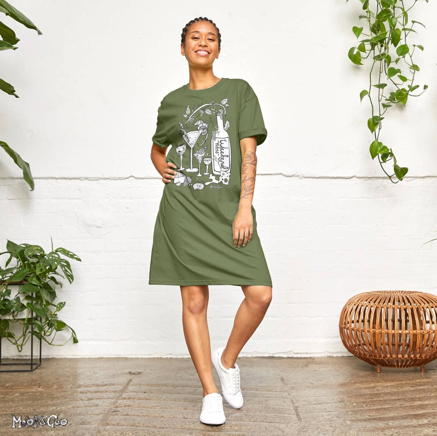model showing off the khaki green long t-shirt dress with a wine, cheese a biscuits theme, designed by MooksGoo