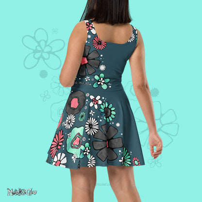 back view of a model wearing a designer flower power dress, with the colours turquoise, coral pink, black and white, with a teal background. Illustrated dress design by MooksGoo
