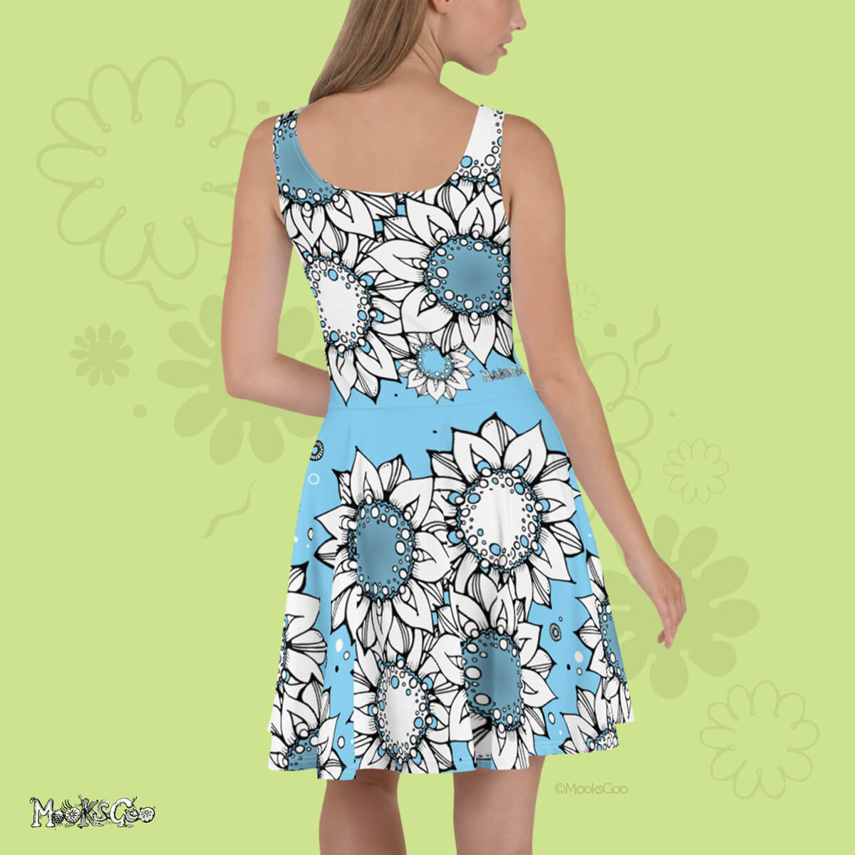 Back view of a Quirky and fun women's floaty light skater dress with hand drawn illustrated black and white sunflowers, dots and wheels, designed by MooksGoo