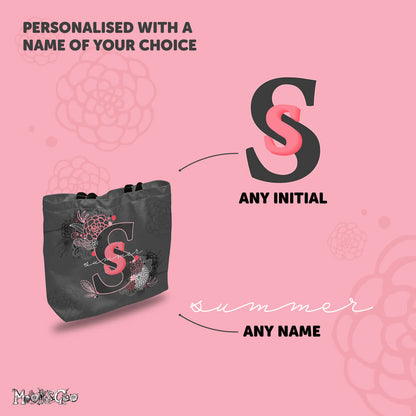 Personalised with any name and initial tote bag, designed by MooksGoo. Image shows a finished bag with examples of what can be personalised. 