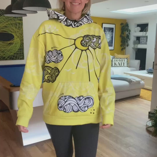 a lady wearing a bright yellow hoodie with illustrated clouds and a sunshine, walking in a modern interior house, designed by MooksGoo