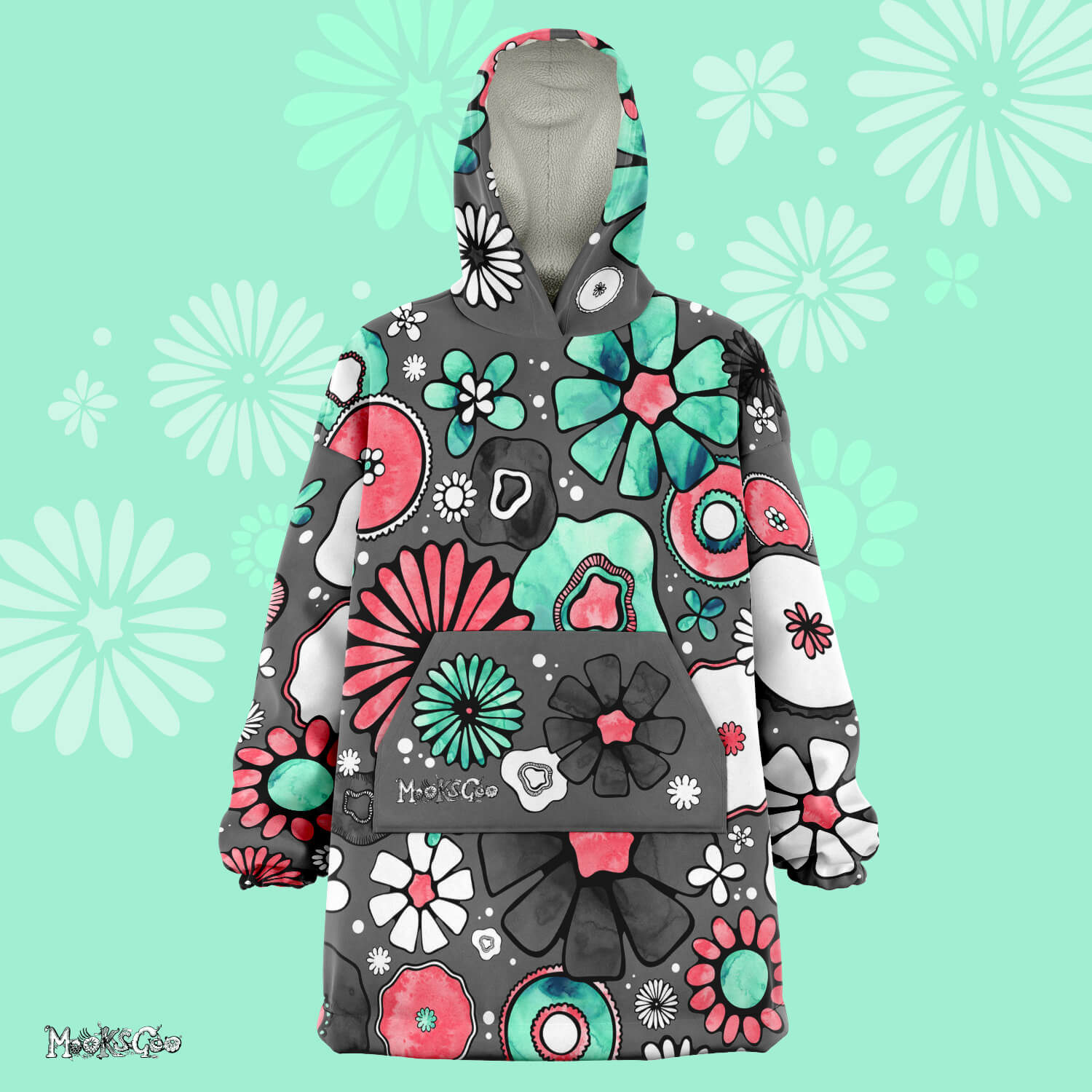 A lady dancing in a warm, thick Flower Power Snug Blanket Hoodie with illustrated flowers, designed by MooksGoo