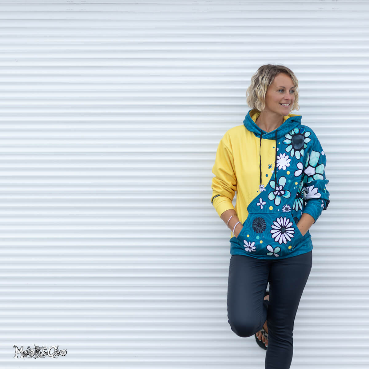 Teal and Mustard yellow colour split unisex hoodie modelled by Michelle Lott (MooksGoo). Photography by Julian Winslow along Shanklin seafront on the Isle of Wight