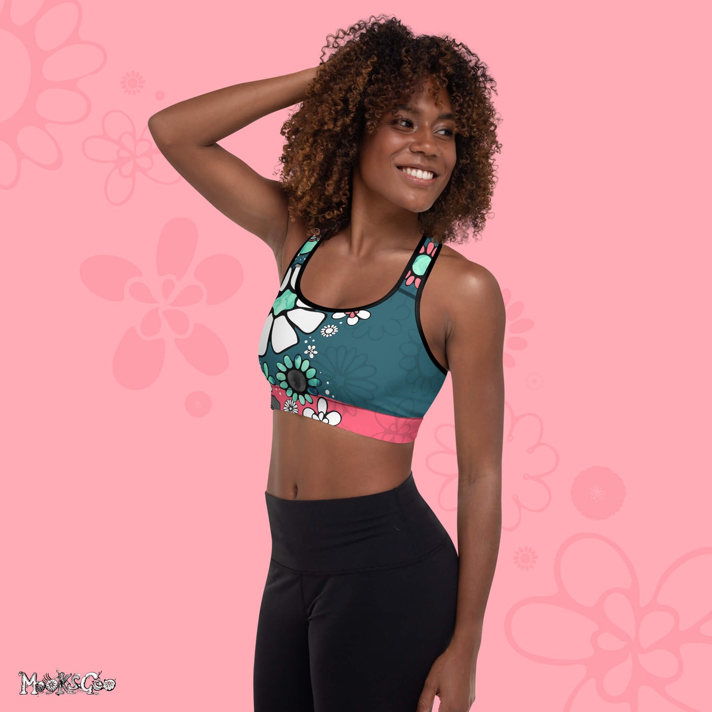 Supportive bright and funky flower power sports bra designed by MooksGoo, with turquoise and coral pink illustrated flowers - left side view. 
